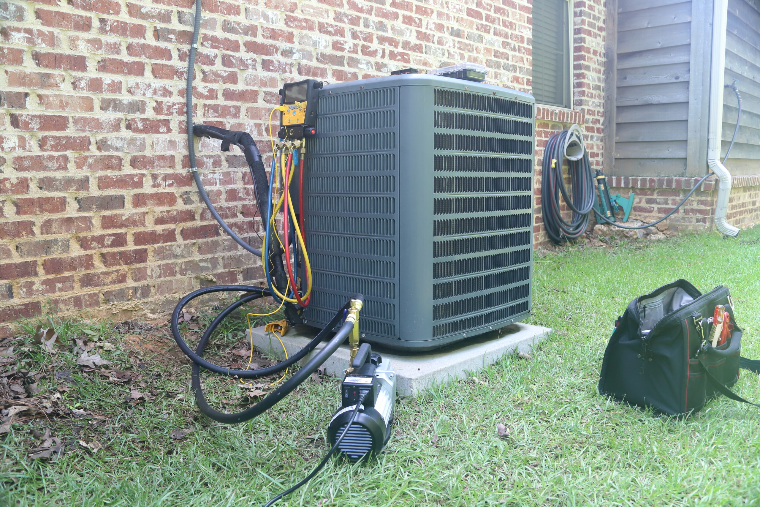 AC Unit with tools attached, getting serviced.